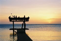 Roatan, Honduras. Locals on the Pier. by Morgan Douglas 